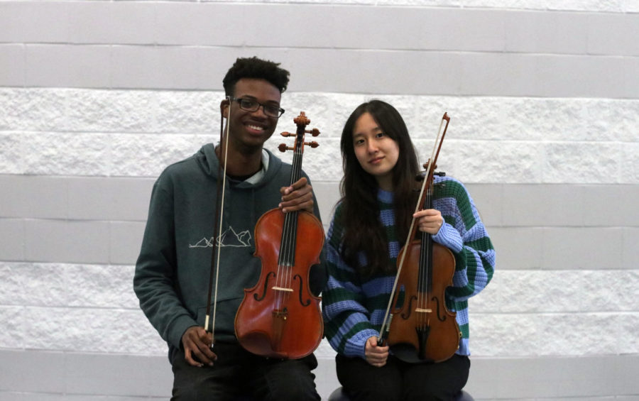Senior+Kejuan+Thompson+and+junior+Lauren+Ahn+sit+with+their+viola+and+violin.+They+will+attend+the+2022+Texas+Music+Educators+Association+%28TMEA%29+convention+in+San+Antonio+in+February.%0A