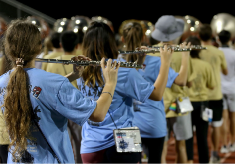 The flute section practices at rehearsal on Dec. 9. Since returning from the UIL State Marching Band Contest in San Antonio on Nov. 9, the band began marching long distances on the track during rehearsal to prepare for the 5 ½ mile trek they will complete in Pasadena. 