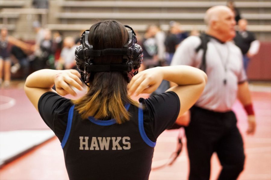 Junior Gloria Lee prepares for a district match at the Lewisville High School arena on Feb.5.