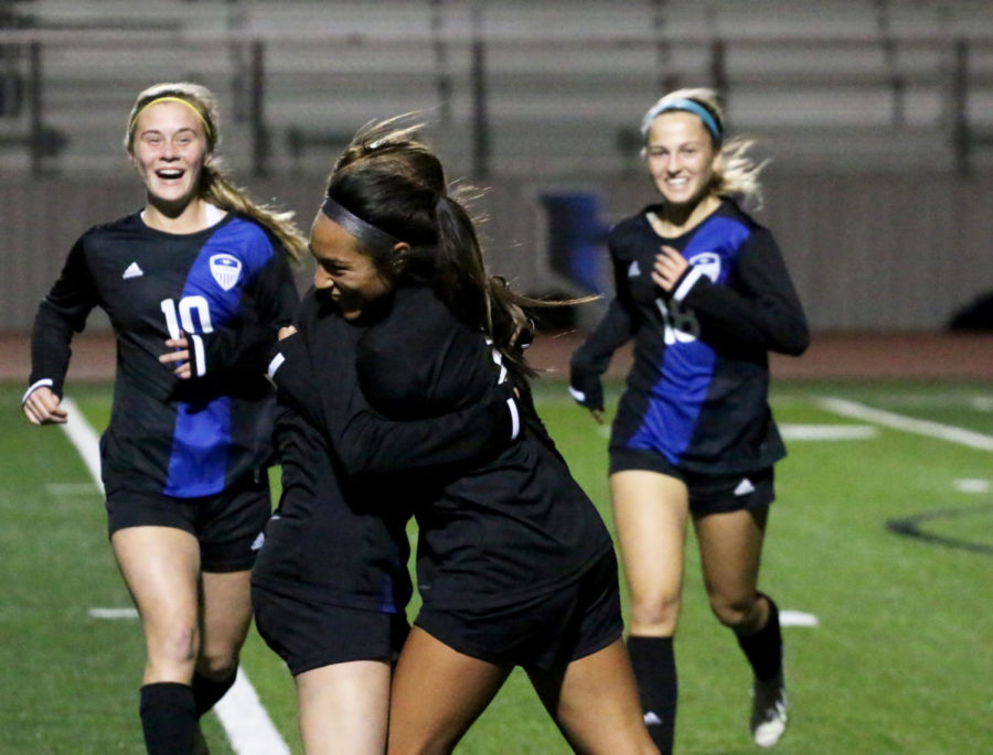 Sophomores Molly Lundy and Kayla Martinez hug after Martinez scored a goal.