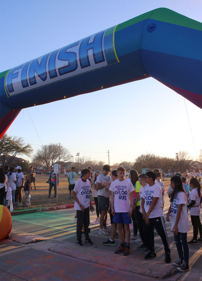 Middle schoolers line up at the beginning of the color run to start running. The color run was divided by grade with three sections for the sixth, seventh and eighth. A run for elementary school students was also held, as well as a combined run for anyone else who wanted to participate.