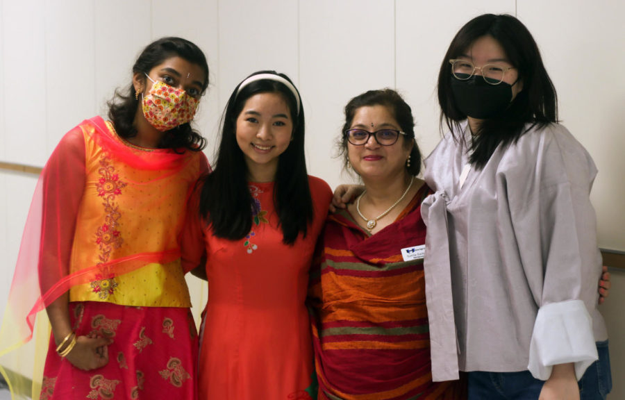 Hawk Fest committee member Sunila Gaikwad stands with Ohviya Sivashankar, Ellie Ton and Madeline Chong, who are dressed in their traditional clothing. Student Council organized dress-up days, such as dressing like an international celebrity or wearing traditional clothing, to celebrate the days leading up to the event.