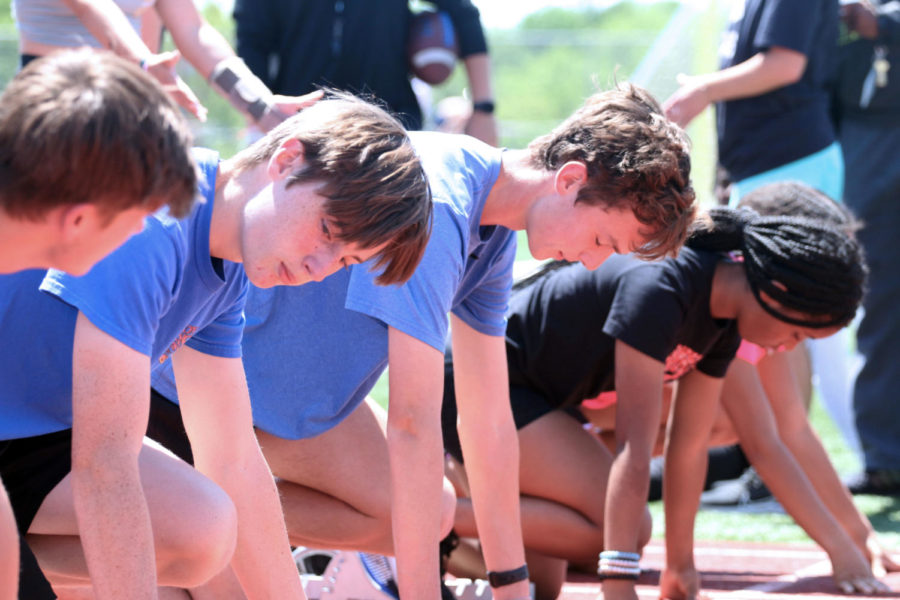 Freshman Adam Vorhaben lines up with his teammates for a race during practice on Tuesday afternoon. Track practices on the football field every day during fourth period.