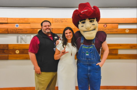 Newly promoted principal Rachel Flanders poses with Lewisville High School Harmon’s mascot and Lewisville High School principal Jim Baker. Flanders’s lifelong dream was to become principal at Harmon in order to give back to her community.