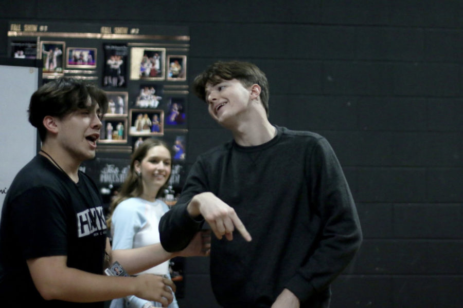 Juniors Jaxon Ryan (left) and Jacob Martin (right) perform an improv scene during an after school practice on May 9. The two of them have been on the improv team all three years and said they will continue in the varsity theater class next year.