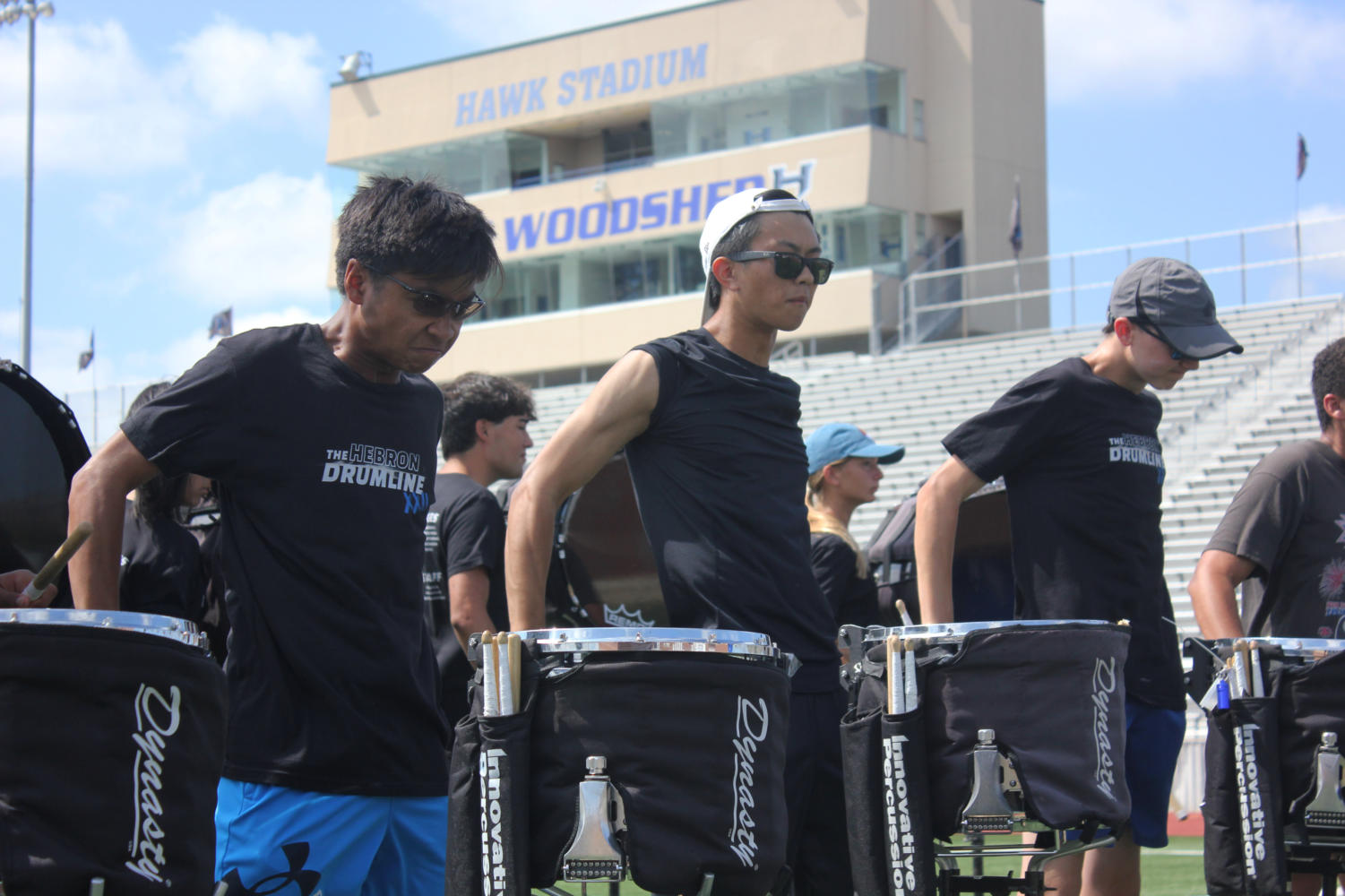 Snare drummers junior Adrian Hautea (left), senior Brandon Liu (middle) and sophomore Ben Guidry (right) finish a run of their 2022-2023 show, “Out of Time!” Percussion rehearsed from 11:15 a.m. to 2:00 p.m. in preparation for the contest.