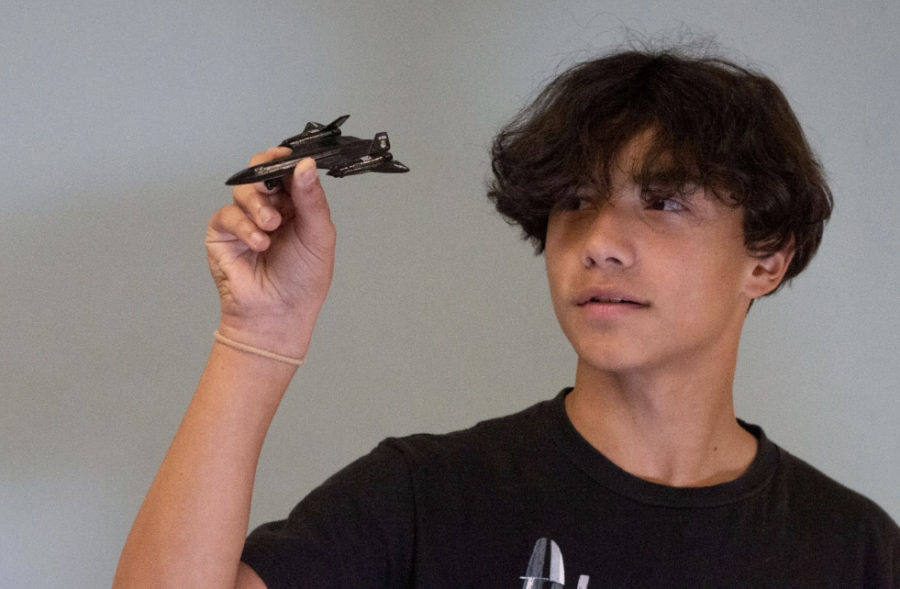 Zach Carvajal flys a toy plane. It was the first plane he got as a child and is usually displayed on a shelf in his room.

