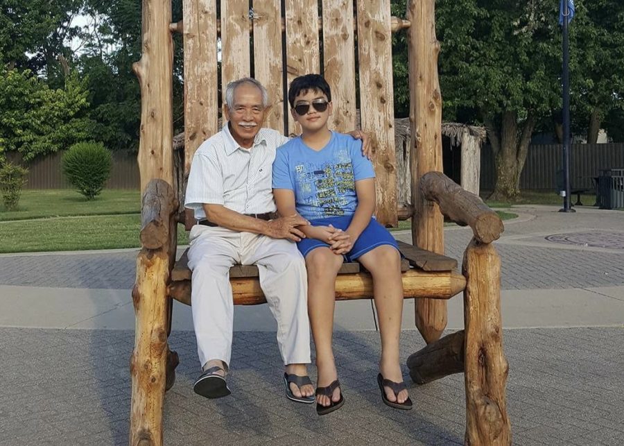 My late paternal grandfather and I pose on a monument during a road trip to Missouri in 2014.