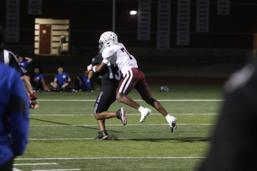Running back Bryson Spriggs is tackled by Plano cornerback Rohon Kazadi while running the ball. This play resulted in a 38-yard run from Spriggs. 