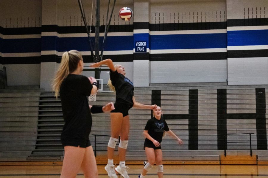 Senior Delaney Nicholls prepares to hit the ball over the net in the team’s game against Flower Mound on Oct. 14. The team lost the game with a score of 3-0.