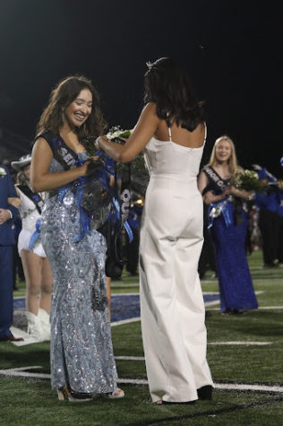Senior Isabella Nations is crowned the homecoming queen by last year’s queen Kaitlyn Hoang at halftime of the homecoming football game on Sept. 23. As a band officer and section leader, she had just finished marching with the band in her sparkly, floor length dress.
