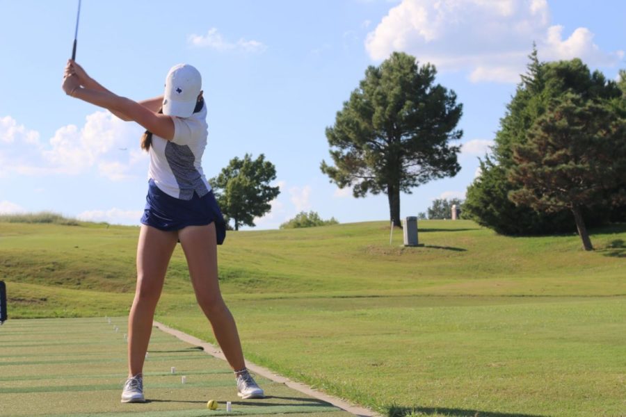 Sophomore Stalee Fields swings a golf club at the Coyote Ridge Golf Club on Sept. 19. She has been playing golf for about 12 years.