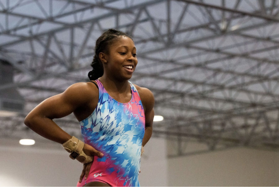 Sophomore Sydney Etufugh prepares to do a flip off the bar at Texas Dreams Gymnastics on Nov. 7. Etufugh trains her basic gymnastic skills every Monday, paying special attention to beam, which she believes to be her weakest of the four parts of the sport. 