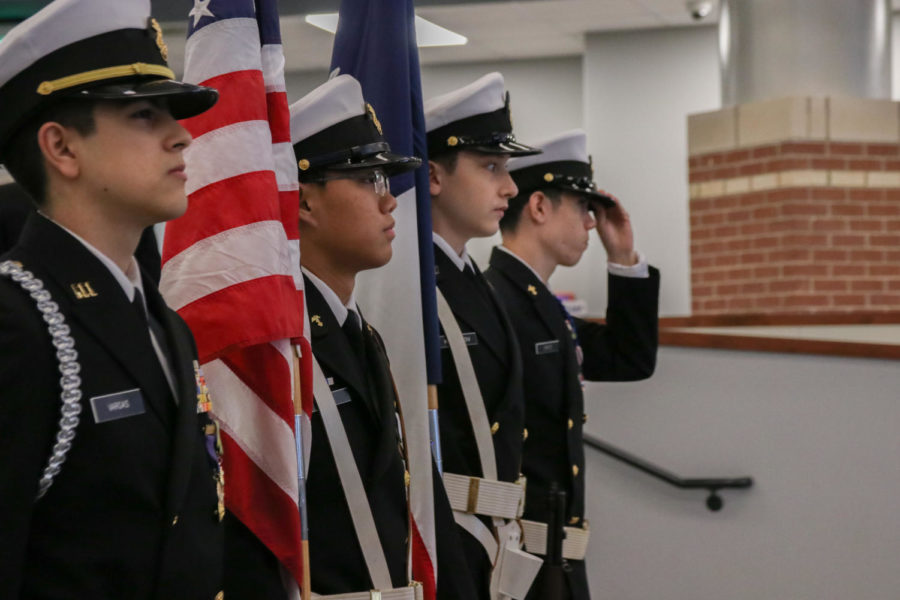An event was held in the library on November 11th to commemorate veterans at Hebron. Here JROTC presents the colors before the singing of the national anthem. 