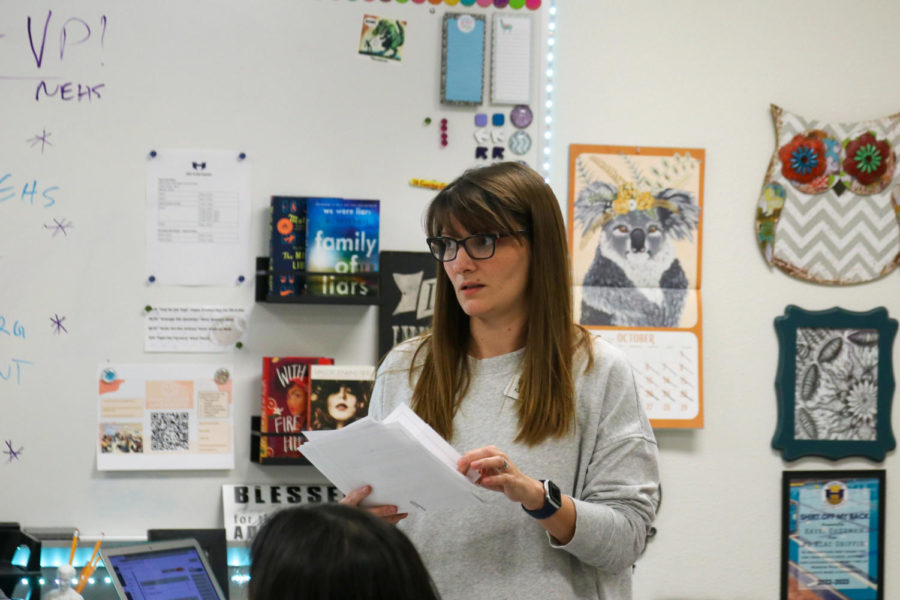 National English Honor Society sponsor Kaysi Sheehan hands out acceptance letters to new members during the organization’s first meeting on Oct. 26.