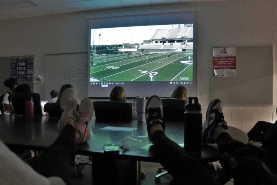 The team reviews footage in its meeting room on Jan. 17. Players watched footage of Marcus to find out how to play strategically against them.