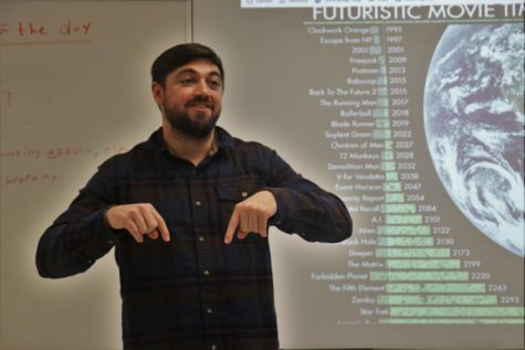 English II teacher Robert Nuñez talks to his Sci-Fi class about the movie “Escape from New York.” He started class by talking to students and asking about how their weekends went. 