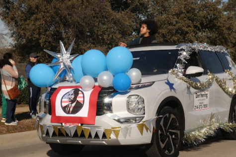 Cars decorated in parade gear reach the end of the parade outside of Ted Polk Middle School. There were an array of parade-goers, ranging from large groups walking on foot to others in decorated cars. Some goers even threw candy to onlookers.