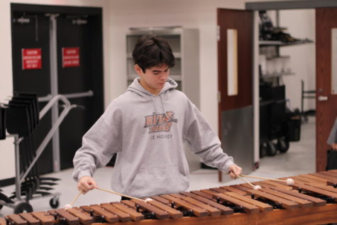 Senior Dylan Khangsar performs his spring solo for the percussion class. Most students in the percussion section have to learn at least one keyboard solo and one snare solo per year, yet Khangsar has learned two keyboard solos a year for the past two years. 

