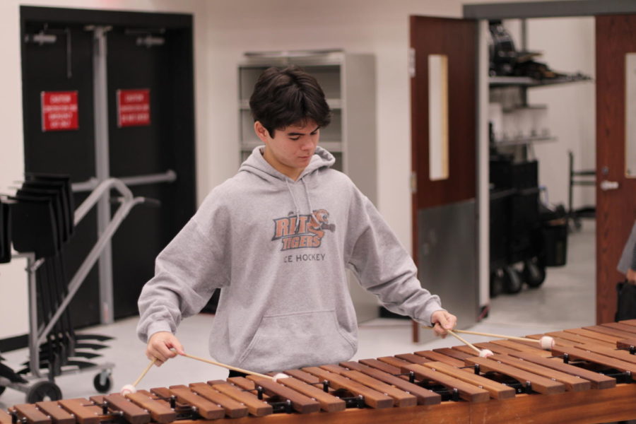 Senior+Dylan+Khangsar+performs+his+spring+solo+for+the+percussion+class.+Most+students+in+the+percussion+section+have+to+learn+at+least+one+keyboard+solo+and+one+snare+solo+per+year%2C+yet+Khangsar+has+learned+two+keyboard+solos+a+year+for+the+past+two+years.+%0A