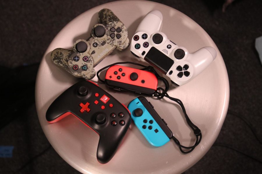 Controllers+from+various+consoles+are+laid+out.+My+household+has+had+a+total+of+10+consoles+and+gaming+devices+throughout+the+years.