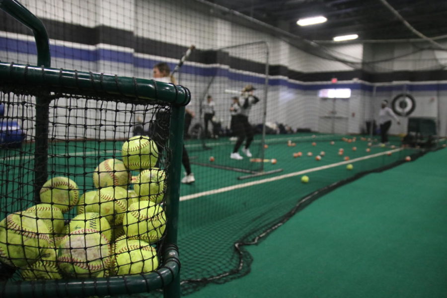 The+softball+team+practices+indoors+on+Feb.+10+since+rain+flooded+the+fields.+They+practiced+pitching+and+hitting+to+prepare+for+their+game+against+Denton+Guyer+on+Feb.+11.