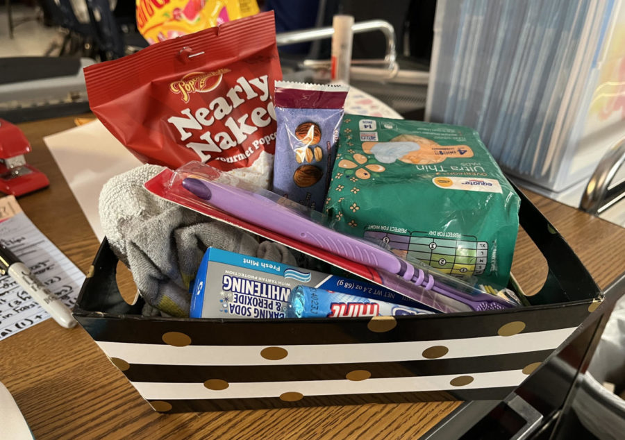 A basket with snacks, a toothbrush, toothpaste and pads is one of the baskets that was donated to the donation.