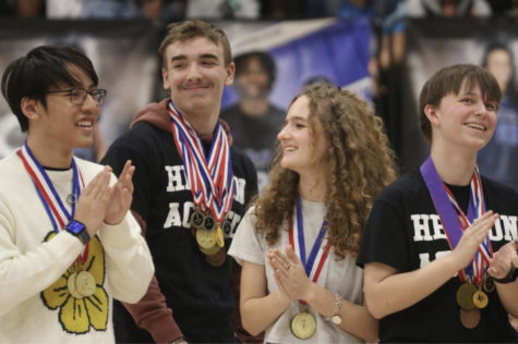 Seniors Kaden Nguyen, Collin Smith, Serena Cavanaugh and Caroline Burrow clap while being honored at the pep rally on March 1 for winning fifth place at state on Feb. 26. This is Hebron’s first time placing in the top five at state. 