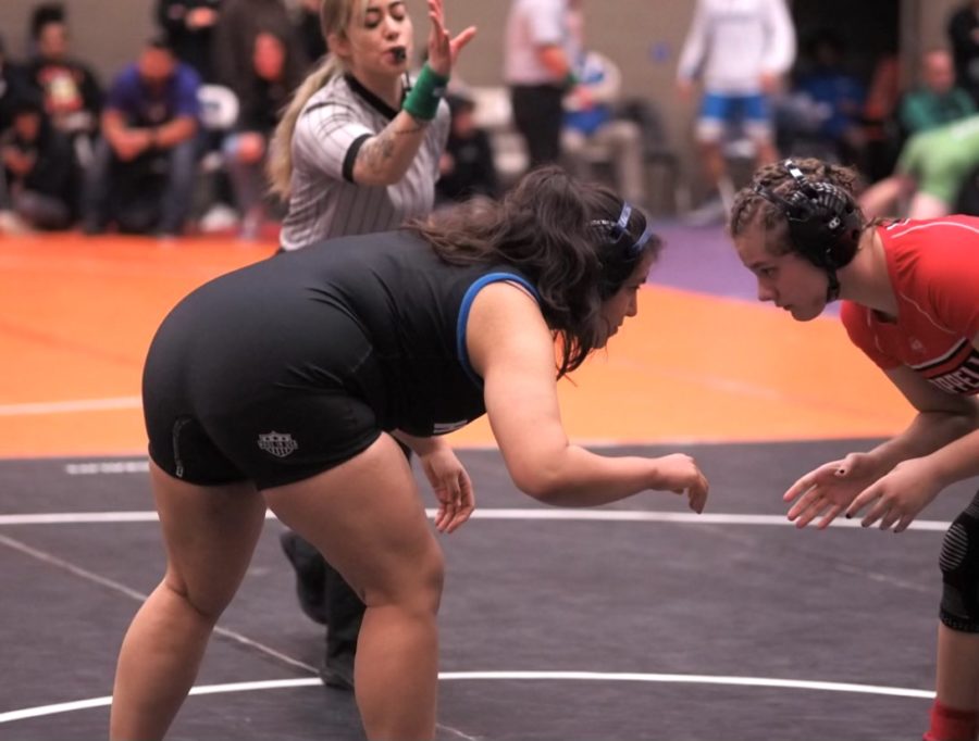 Senior Stephanie Negrete faces down her opponent at a district match against Coppell on Feb. 3.