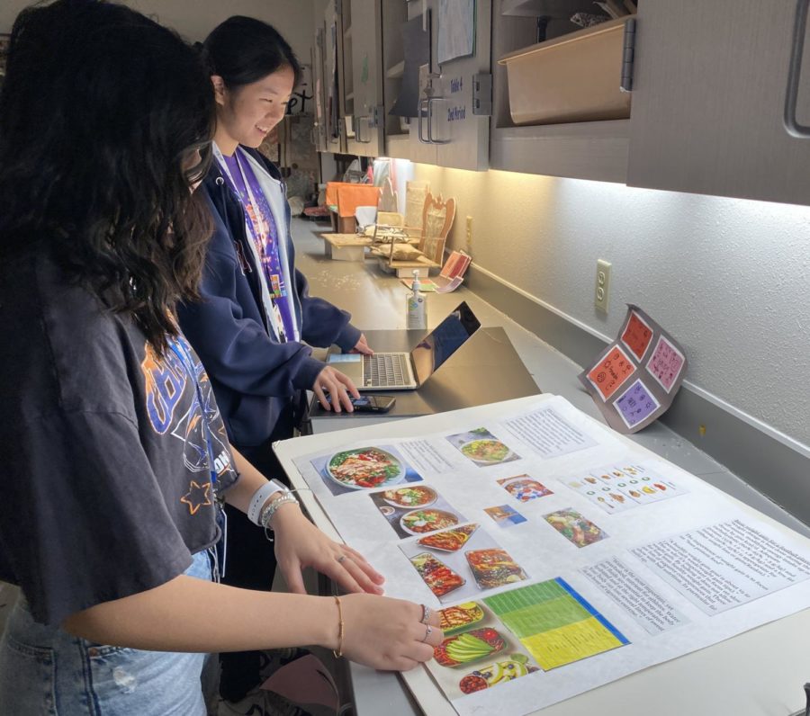 Seniors Hiba Virani and Ella Zou finish their poster for sports nutrition, the competition they are competing in alongside FCCLA president Liana Manochahri, at the state competition at the Dallas Hilton Anatole on March 31. The five different competitive teams that advanced from regionals four weeks ago were as follows: fashion design, job interview, nutrition and wellness, sports nutrition and sustainability challenge.