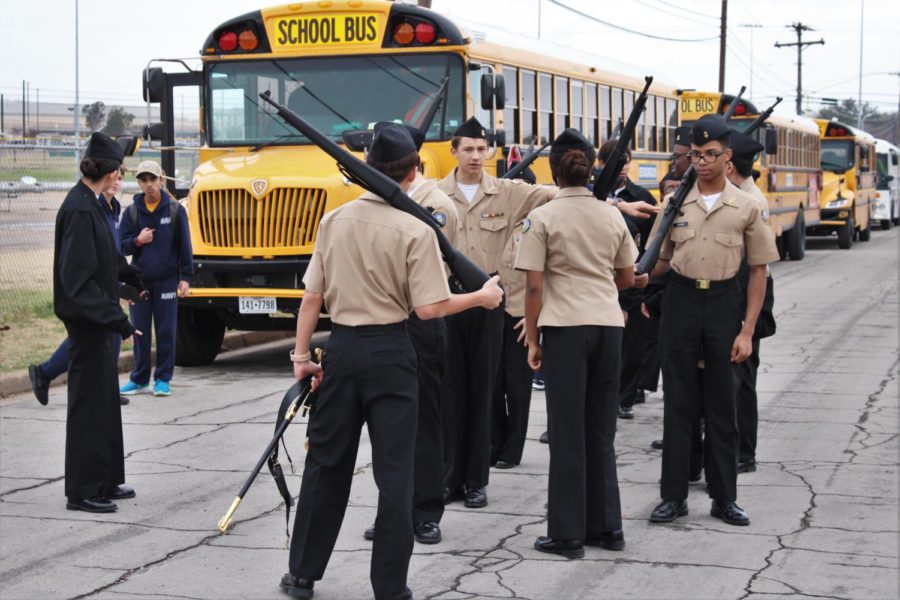 Cadets+prepare+in+front+of+buses+as+they+wait+for+the+armed+drill+march+at+the+Waco+meet+Jan.+28.