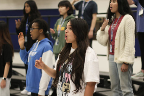 Freshman Carys Turner warms up during a practice for the Belle Chanson Treble Choir on April 3. Belle is an intermediate level all-female choir and members must audition to join.