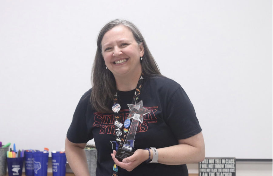 English teacher Donna Friend stands in her classroom with her LISD Teacher of the Year award in hand. She has been teaching for 25 years and said she will continue to strive for more opportunities to better the school in the future. 
(Photo by Juliana Mun)