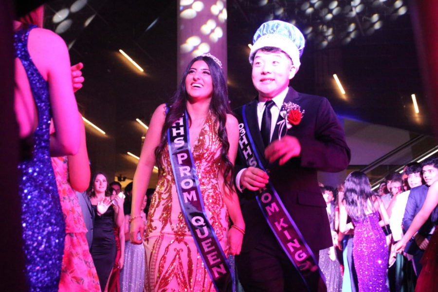 Seniors Melody Ebrahimi and Josh Park stand next to each other after they were announced as prom queen and king. Ebrahimi and Park are both heavily involved in school as the class president and the president of HASA.