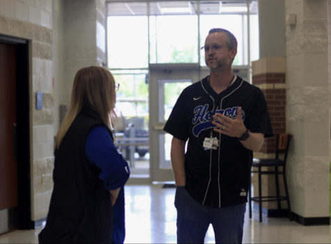 Associate principal Dr. Jacob Garlinger talks with assistant principal Marybeth Coen by the cafeteria during C lunch. Garlinger started his career as a band director before moving to Hebron to be an assistant principal. He became associate principal in 2019 after being chosen by principal Amy Boughton.