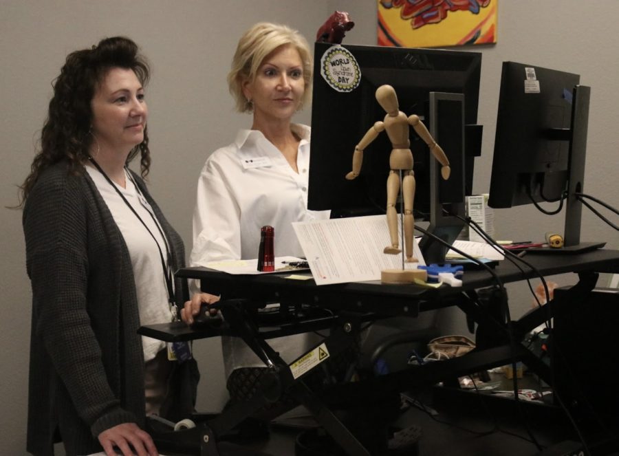 Nurse Cissy Khan (right) and assistant nurse Amy Sanchez look through information in Khans office on April 25. Khan has been working as a nurse for about 18 years.
