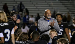 Former football head coach Brian Brazil meets with the football team after beating Plano West in 2021. Brazil held the position from the school’s opening in 1999 until his retirement in 2022.
