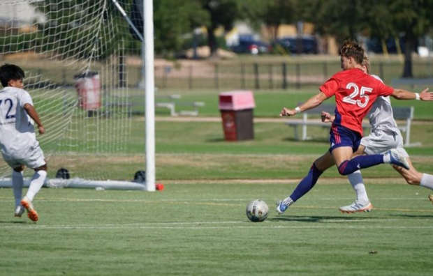 Sophomore Ian Witis shoots at the opposing team’s net during a game while playing for the FC Dallas Youth Squad. (Photo provided by Danny Patiño)
