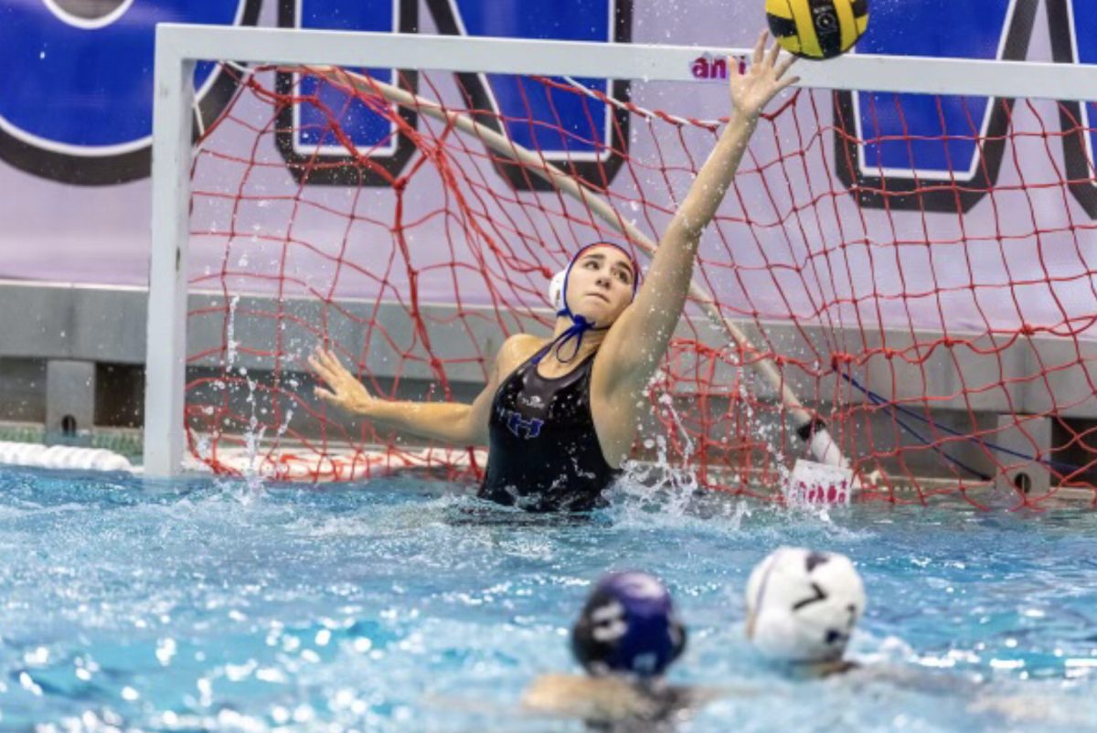 Senior water polo goalie Savana Slaughter blocks the ball at a game at Eastside Aquatic center. Slaughter said her experiences have helped her realize what she wants to do in college and made her a better person. (Photo provided by Savanna Slaughter)
