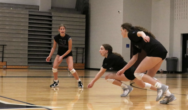 Outside hitter Sophie Hoke, right side hitter Cadence McDonald and outside hitter Cambria Freymuth get set to receive the ball. To make playoffs, the team has to be in the top four in the district; with just two games left in the regular season, the team is currently fourth.
