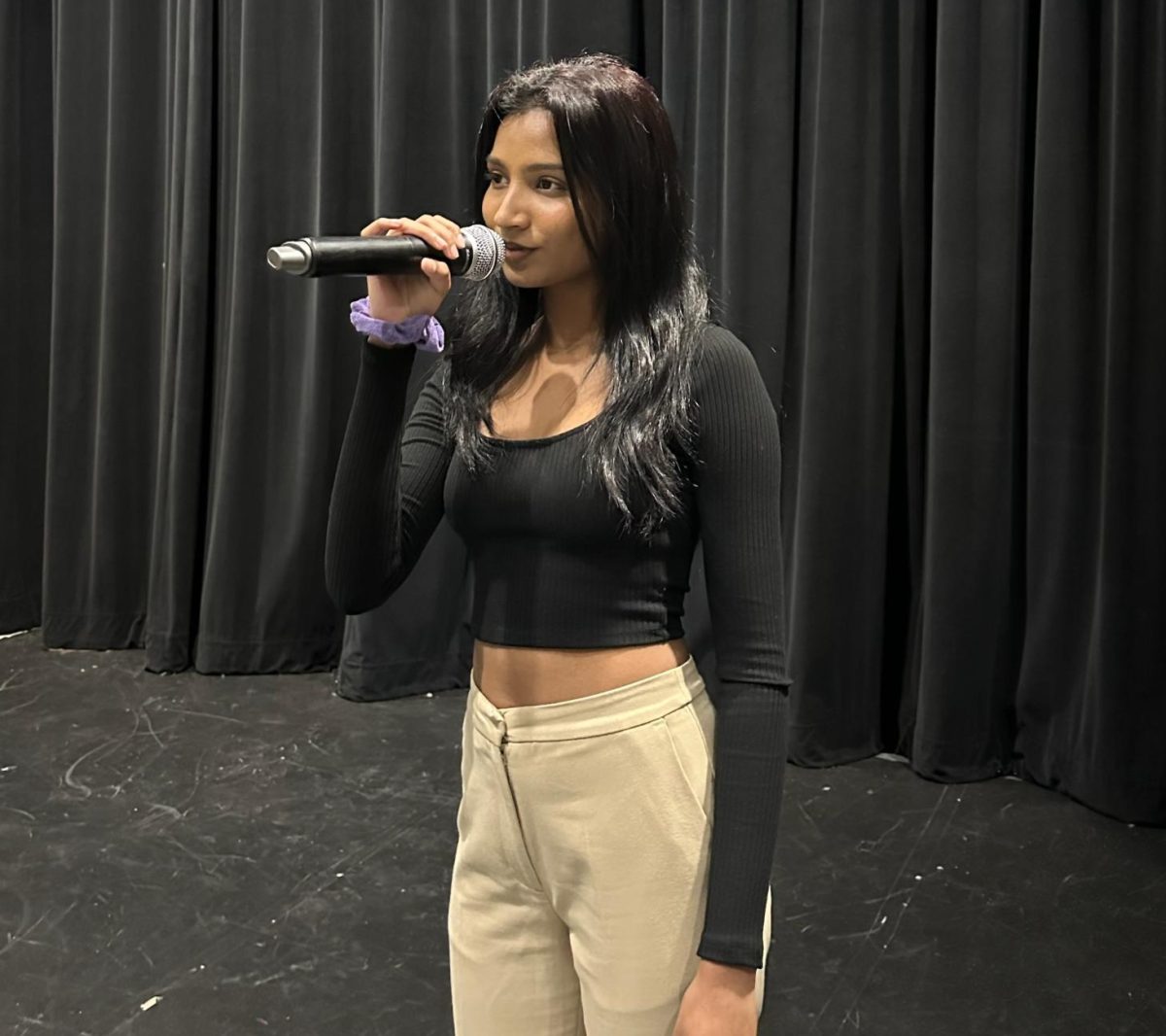 Abraham rehearses for one of her many performances. Between school and out of school singing she also finds time to sing in the Choir Program