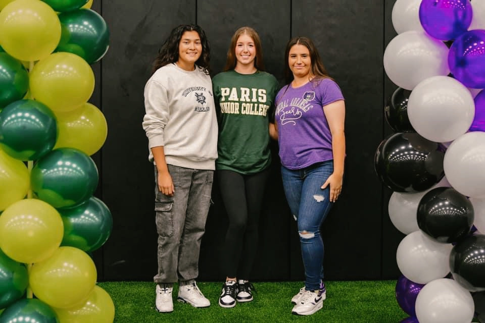 Seniors Ana Hawthorne (left), Alyssa Sneed (middle) and Lucy Crowder (right) pose for a photo together on signing day on Nov. 8.