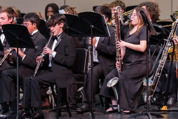Junior Marshall Wyatt (left) and senior Mie Bakuya (right) play their respective instruments, the clarinet and the bass clarinet at TMEA All-State. The band fundraises for events such as the one pictured. (Photo provided by Hebron Band Booster Club)
