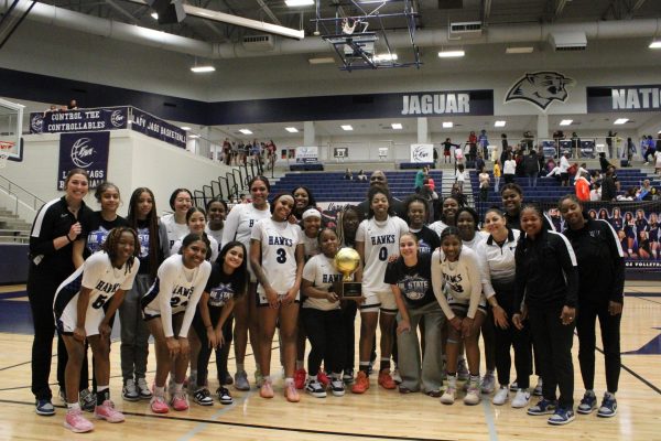 The girls basketball team poses for a photo after they defeated Little Elm in the third round of playoffs. The seniors of the girls basketball team secured their 100th win for the program during their playoff run this season.