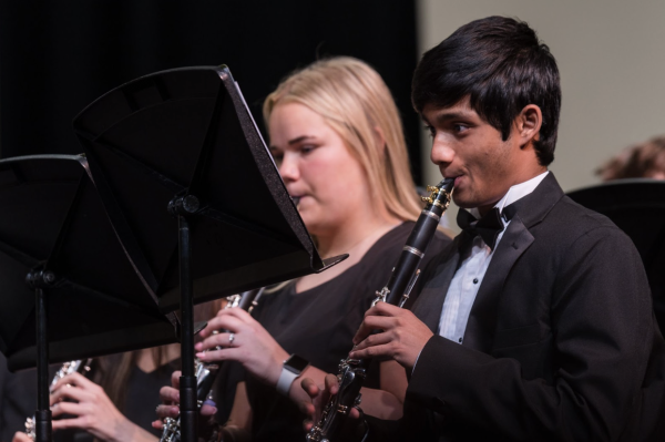  Sophomores Pranav Gillella and Kaylee Klein perform during the Region band concert, on Jan. 13. The ensemble showcase is held to prepare students for the upcoming LISD solo and ensemble competition on March 2.