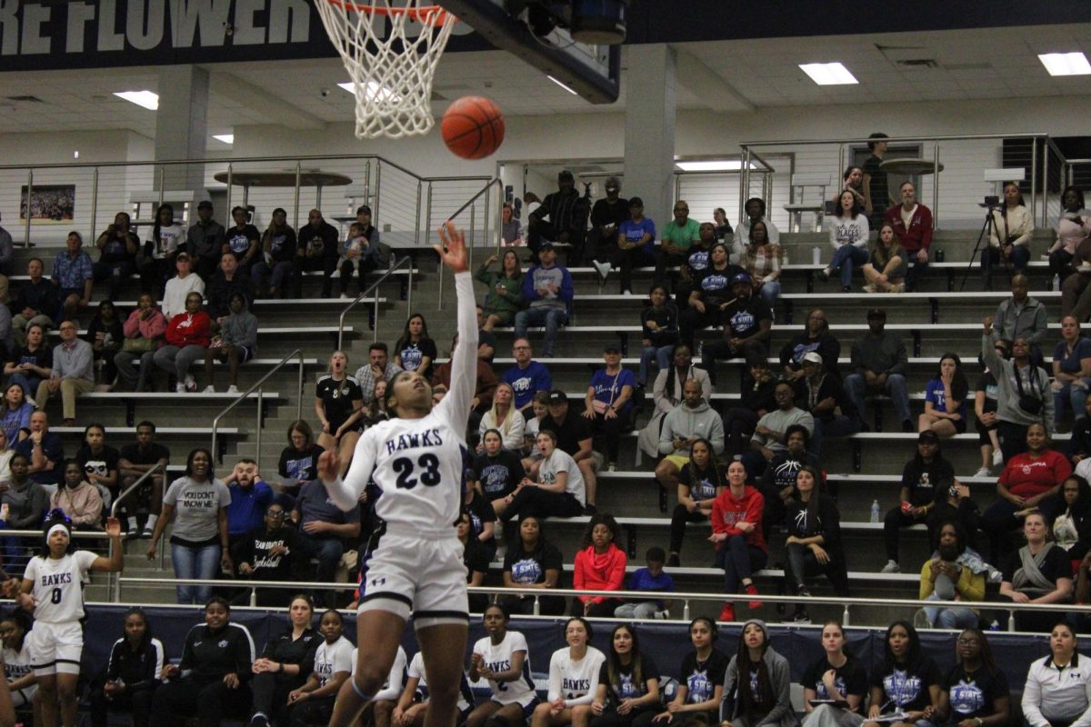Guard and captain Paris Bradley shoots a layup against Little Elm at the quarterfinals game on Feb. 20. The Lady Hawks beat Little Elm 53-47 and went on to the semifinals.