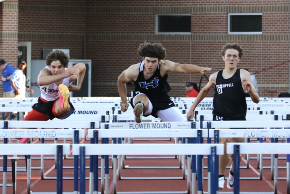 Senior Brooks Mitchell competes in a 100 hurdling race in district finals at Flower Mound High School last year. He has been hurdling since seventh grade and will continue in college. 