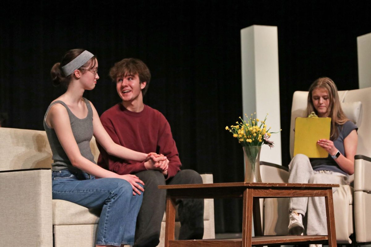 Seniors Sophia Wheeler (left), Max Turman and Hana Robson rehearse a scene in the beginning of their UIL One Act play, “Emma’s Child” on March 6. Theater will perform it for free in the auditorium on March 19 at 7:00 p.m.