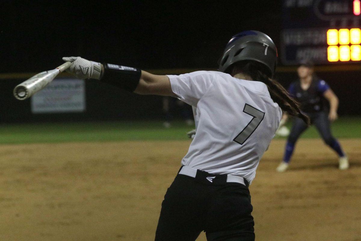 Second baseman Lilly Pirrello swings the bat during the game against Plano West on April 16. The team won 2-0.