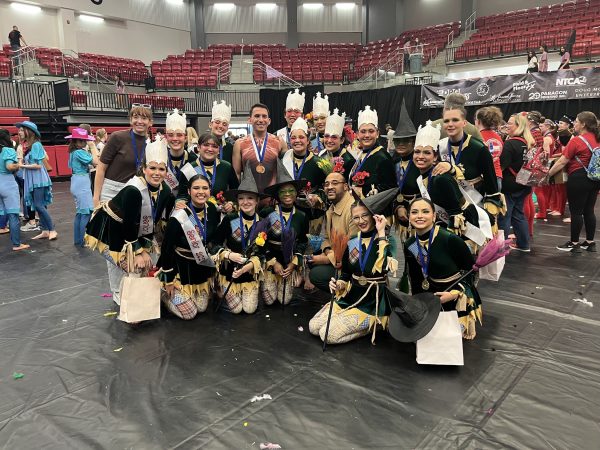 The varsity color guard team poses for the photo after finishing first
at finals for the North Texas Colorguard association. Students will help serve food to VIP guests and perform the show at the end of the gala. (Photo provided by Michelle Vasquez)